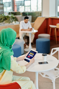 Woman using iPad Pro in the cafe_Page 6_12 from Whiite Modern Good Books Gone Bad Book Cover (A5 Document)