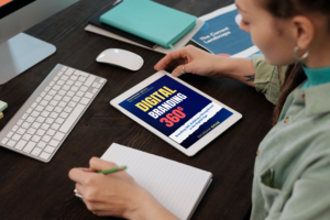 iPad in the hand of a woman taking notes in the office_Page 6_12 from Whiite Modern Good Books Gone Bad Book Cover (A5 Document)